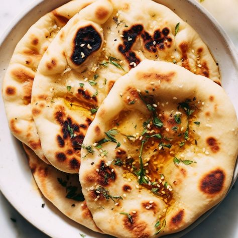 "This easy guide on how to make 2-ingredient naan, a light and fluffy flatbread, will revolutionize your homemade Indian meals! This naan is not just a simple bread; it's a flavor-packed side that elevates your entire meal. In less than 10 minutes, you can create this no-yeast bread that's perfect for both beginners and confident home cooks. For more easy-to-follow bread recipes check out our homemade bread rolls or this savory garlic naan bread. Why This is The BEST 2 Naan No a Easy Naan Bread Recipe No Yogurt, 3 Ingredient Naan Bread With Yogurt, Naan Bread Recipe No Yeast, Easy Nanna Bread No Yeast, Homemade Naan Bread Easy No Yeast, 2 Ingredient Naan, Naan No Yeast, Fluffy Flatbread, Naan Bread Recipe No Yeast No Yoghurt