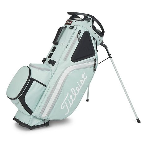 The Titleist Hybrid 14 Bag is an ideal crossover between a traditional stand bag and a cart bag. The Titleist Hybrid 14 Bag features an integrated cart strap tunnel and premium shoulder straps making it easy to carry or push with a cart. With nine pockets, the Titleist Hybrid 14 Bag offers plenty of storage for all your golfing essentials, while the low-profile top cuff makes accessing your clubs easier. Made from premium materials and featuring a convenient design, the Titleist Hybrid 14 Bag is Golf Aesthetic, Golf Shoe Bag, Golf Stand Bags, Titleist Golf, Golf Stuff, Kids Golf, Girls Golf, Tea Green, Golf Attire