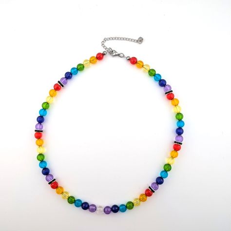 This stunning LGBTQ+ pride crystal necklace features a vibrant rainbow of crystal beads, perfect for expressing your pride, support or solidarity. Handcrafted with high-quality crystals, vinyl coated stainless steel wire and hypoallergenic materials this necklace is both beautiful and durable. 8 mn crystal beads. This edgy statement piece is ideal for the LGBTQIA+ community and it's allies. Show your pride with this colorful rainbow crystal necklace! -- Stainless steel vinyl coated wire -- Stain Cheap Rainbow Beaded Chain Necklace, Pride Jewelry Necklaces, Handmade Rainbow Choker Beaded Necklaces, Vibrant Rainbow Beaded Necklaces, Vibrant Adjustable Rainbow Necklace, Crystal Bead Necklace, Rainbow Crystal, Rainbow Beads, Lgbtq Pride