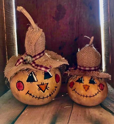 Scarecrow Gourds
Hard shell gourds decorated to look like scarecrows with burlap hats and painted faces Witch Gourd Painting, Pumpkin Gnome Painting, Painted Scarecrow Pumpkin, Scarecrow Pumpkin Painting Ideas, Painted Scarecrow Gourds, Scarecrow Pumpkin Decorating Ideas, Pumpkin Gourds Fall Decorating, Bushel Gourd Crafts, Fall Painted Gourds