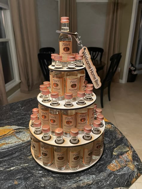 This shot cake tower holds 36 mini bottles of Fireball or Titos. 50 ml of either.  Makes a great gift for the hard to shop for person or to display at an event like wedding or birthday.  These are the mini bottles. Not full size.  The fireball bottles need to be slightly turned to fit.  See pictures. Four layers 17 on bottom, 12 on next level, then 6 and one to top it off and create the fourth level. This works with fireball and any TALL narrow bottles like tifos or grey goose. Does not work for patron or absolute and they are smaller squattier bottles.  Made of plain unfinished wood. You can paint this if you want to add color. Custom engraved fun little keychain and bottle neck ring included. These are made out of the same unfinished wood. Just a cute little add on to make this item cust Vodka Themed Party Ideas, Shot Bottle Gift Ideas, Funny Birthday Gifts For Women, 21 Birthday Cake For Him, Alcoholic Gift Baskets, Diy 21st Birthday Gifts For Her Baskets, Airplane Bottles Liquor Gift Ideas, Birthday Ideas For Adults Women, Liquor Themed Birthday Party