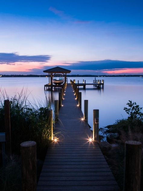 Even at night, the dock is inviting allowing guests to venture out safely. Button lights sunken into the boards illuminate the way. Hgtv Dream Homes, Lake Dock, Lakefront Living, Dock Lighting, Hgtv Dream Home, Dream Beach Houses, Lan Can, Bay House, Lake Cottage