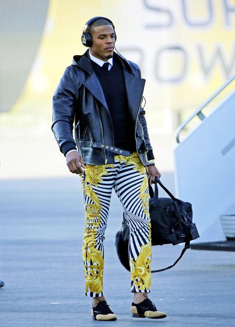 Cam Newton's stand-out style isn't just on the field. Copy Cam's look by pairing wild, printed pants with a tame top, like a black leather jacket. Cam Newton Fashion, Versace Pattern, Conference Outfit, Versace Pants, Cam Newton, Football Outfits, Popular Outfits, Nfl Players, Contemporary Outfits