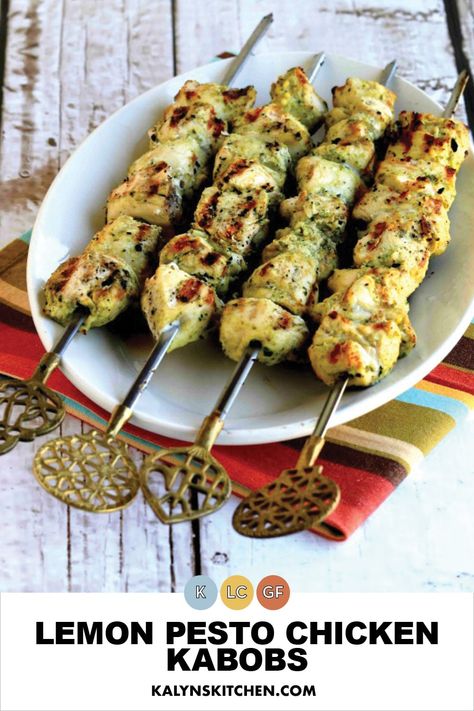 Pinterest image of four skewers loaded with lemon pesto chicken pieces served on a ceramic dish that is sitting on an orange striped napkin. Lemon Chicken Kabobs, Basil Ideas, Recipes Using Pesto, Kabobs Chicken, Grilled Kabobs, Lemon Pesto Chicken, Chicken Videos, Pesto Basil, Summer Sauce