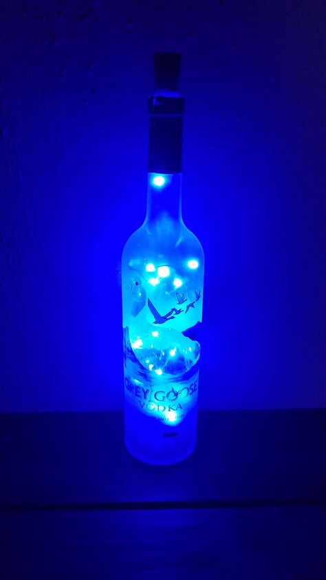 Grey Goose Bottle, Bottle Decoration Ideas, Bottle Decorations, Liquor Bottle Crafts, Bottle Trees, Bottle Decoration, Whisky Bottle, Blue Lights, Bottle Decor