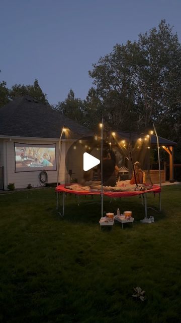 Mason Smith on Instagram: "My daughters love trampoline movie night even though they only end up watching about 25% of the movie. So many memories have been made on that 10 foot bouncing circle!

If you’re looking for a projector for inside or outside this summer, check out @xgimitech! I am blown away by the quality, clarity, and all around function of this projector! #xgimi #movienight #trampolinemovie #dad" Outside Projector Ideas, Movie Night On Trampoline, Movie Night Backyard Ideas, Trampoline Set Up Ideas, Trampoline Lights Ideas, Movie Night Kids Party, Trampoline Movie Night Ideas, Projector Outside, Trampoline Movie Night