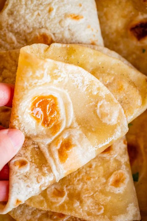 Roti - The Best Buttery Indian Flatbread from The Food Charlatan. I can't get enough of this Roti recipe! Roti is a super easy and delicious Indian flatbread. It is amazing when served with curry, totally perfect for sopping up extra sauce! I have all the tips you need to make sure this Indian bread turns out super soft. I will show you how to make roti, step by step! It is similar to naan but has no yeast in the dough. Traditionally made with atta flour, my version instead uses bread flour. Bread Soft, Roti Recipe, Food Charlatan, Indian Bread, Chicken Tikka Masala, Chicken Tikka, Bread Flour, Indian Dishes, Flatbread