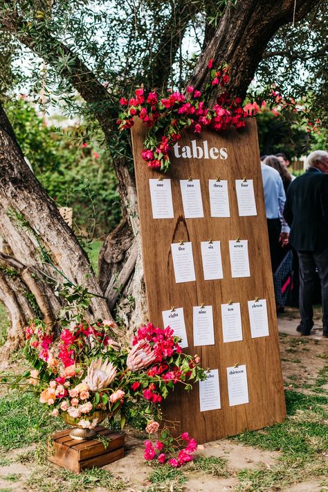 modern wooden wedding seating chart with bougainvillea Seating Chart Wedding Ideas Mexican, Inside Wedding Isles Decoration, Mexican Seating Chart, Mexican Wedding Seating Chart, Buganvilla Wedding, Cheap Seating Chart Ideas, Spring Wedding Seating Chart, Modern Mexican Wedding Decor, Wooden Seating Chart Wedding