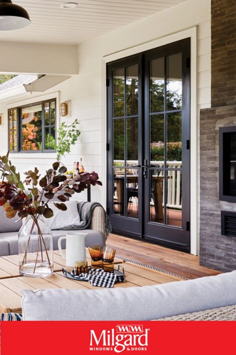 Black French patio doors add an dark elegance to this farmhouse patio. Featuring Ultra™ Series Patio Doors. #patiodoorideas #frenchpatiodoors #patiodoormakeover Black French Doors To Deck, French Door Kitchen To Patio, Bedroom Door To Patio, Bedroom Patio Doors Master, Backyard Doors Ideas Patio, Backyard Sliding Doors, French Door Ideas Exterior, Bedroom With French Doors To Patio, Sliding Door To French Door