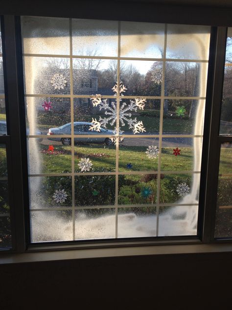 Christmas window art. Spray snow and cling ons Snow Spray Window Ideas Diy, Window Spray Snow Ideas, Fake Snow Window Ideas, Fake Snow On Windows, Fake Snow Window Ideas Spray, Christmas Window Snow Spray, Christmas Window Art Snow Spray, Window Snow Spray, Christmas Grotto Ideas