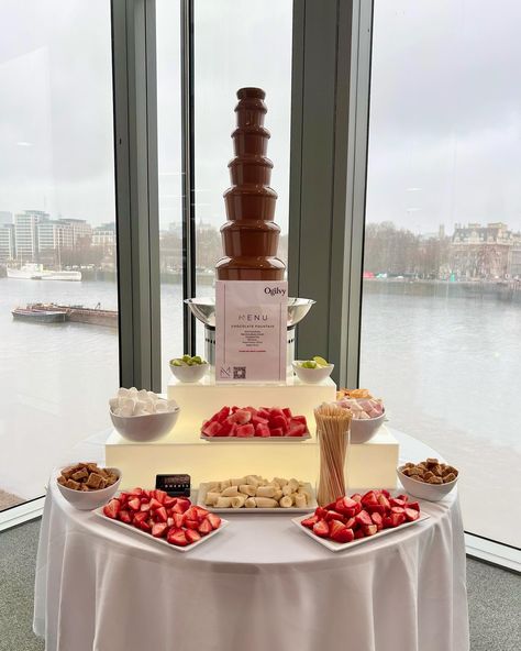 Turning rainy days into chocolatey delights! 🌧️🍫 We had a blast serving up our chocolate fountain at @ogilvyuk event yesterday! . . . Discover our chocolate fountain service: Indulge in our 7-tier chocolate fountain, complete with a selection of unlimited fruit, pastries and baked dippers of your choosing. Our dedicated uniformed attendants keep the servings flowing, ensuring your guests never go without. . 📆Book via link in bio . . . . . #chocolatefountainlondon #ogilvyuk Chocolate Fountain Wedding Ideas, Chocolate Fountain Bar Valentines Day, Chocolate Party Theme, Chocolate Fountain Table, Chocolate Fountain Bar Ideas, Fruit Bar Wedding, Simple Wedding Dinner, Wedding Chocolate Bar, Chocolate Fountain Wedding