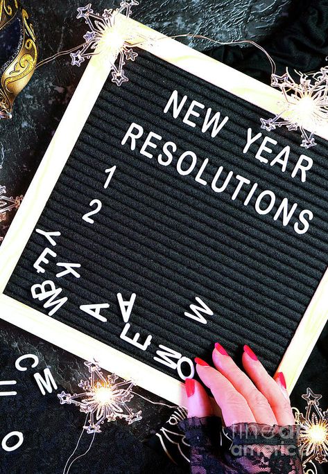 New Year's Eve resolutions letter board and black and gold party