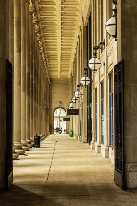 A footpath at Chicago Union Station with tall stone pillars, a man walking, round lights and black metal gate in downtown Chicago royalty free stock Black Metal Gate, Union Station Chicago, Chicago Union Station, Metal Gate, Stone Pillars, Vector Poster, Round Light, Union Station, Downtown Chicago