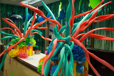 While you are planning your decorations for your ocean-themed VBS this summer, here is a DIY idea you could consider. By making some “swirling cuts” on a standard pool noodle, you can make an inexpensive and fun coral decoration. Deep Sea Discovery Vbs, Surf Shack Vbs, Ocean Commotion Vbs, Vbs Ocean Theme, Submerged Vbs, Ocean Vbs, Ocean Commotion, Vbs Decorations, Under The Sea Decorations