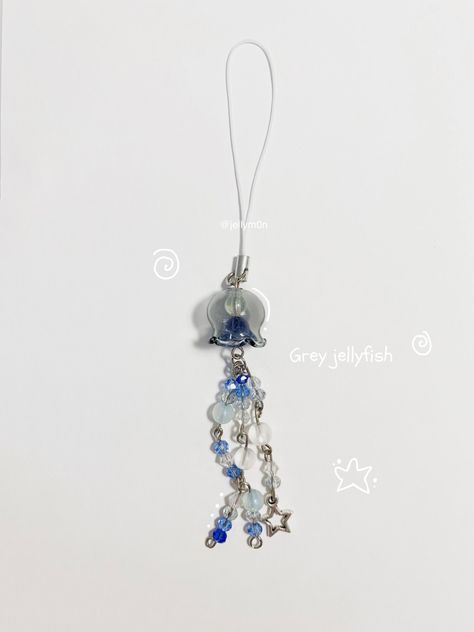 Available now worldwide on my website jellymoon.ae or @jellym0n in instagram dm to order! . . . . . . . . . . . . . . . . . . . . . . . .🏷️ #keychain #phonecharm #jellyfish #handmade #beadedkeychain #handmadejewelry #smallbusiness #jewelry #aesthetic #bead #tiktok #lampworkbeads #cutejewelry #pinterestjewelry #beadsoup #Sanrio#coquette #fashion #gift #giftidea #inspo #mom #business #shopping #decoration #bedroom #diy #ideas #stargirl #vintage #summer #beach #cute #nara #toro #studioghibli #nana Ocean Jewelry Diy, Jellyfish Jewelry Diy, Bead Jellyfish, Jellyfish Beads, Bedroom Diy Ideas, Sanrio Coquette, Jellyfish Keychain Beads, Japanese Phone Charm Aesthetic, Jellyfish Keychain