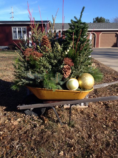 An old wheelbarrow dressed up for Christmas and all of Winter. Old Wheelbarrow Ideas For Christmas, Wheelbarrow Christmas Ideas, Wheelbarrow Christmas Decor, Christmas Wheelbarrow Ideas, Old Wheelbarrow Ideas, Christmas Wheelbarrow, Light Arrangements, Christmas Foyer Decor, Wheelbarrow Decor