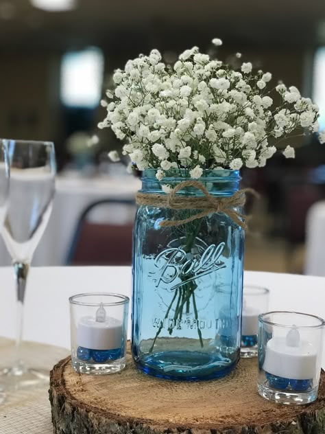 Blue Mason Jars Centerpiece, Light Blue Mason Jar Centerpieces, Tea Light Mason Jar Centerpiece, Simple Wedding Table Decor Reception Ideas Mason Jars, Beach Mason Jar Centerpieces, Blue Mason Jar Wedding, Rustic Blue Table Decor, Blue Glass Centerpieces, Blue Jar Centerpiece