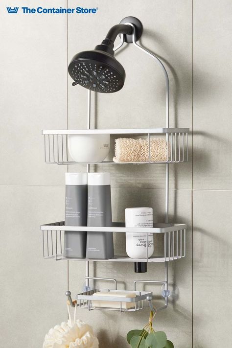 Simple, thoughtful details makes this bathroom shower caddy a smart choice for organizing all your essentials. Two large shelves easily accommodate tall bottles; store shampoos and body wash upright or use the open spouts to flip bottles for access to every drop. At the bottom, a soap tray and two all-purpose hooks let contents air-dry thoroughly between showers. Designed to slide over most shower heads, this storage caddy includes suction cups so everything stays securely in place. Apartment Upgrades, Bathroom Shower Organization, Shower Caddies, Shower Rack, Bath Organization, Caddy Organizer, Shower Storage, Shower Organization, Gorgeous Bathroom