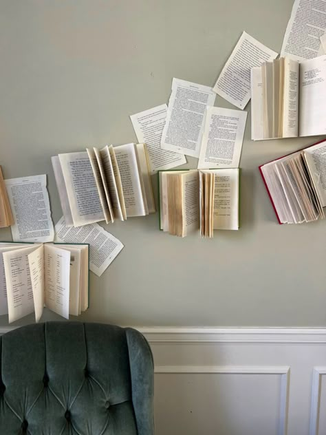 This book accent wall was the perfect feature and backdrop for my baby shower. It was simple to make and is easily customizable. Book Theme Playroom, Book Wall Design, How To Hang Books On The Wall, Book Art Display, Book Board Ideas, Book Wall Decor Ideas, Bookish Room Decor Diy, Book Themed Decor, Books Hanging From Ceiling