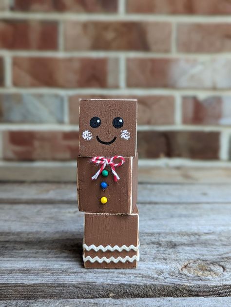 Small Gingerbread Cookie Home Decor Choose quantity: 1, 3 or 5 Hand painted face, pushpin buttons & a bow tie Measures approximately 4.25" tall & 1.5" wide & deep Handcrafted, no two are the same For indoor use Mini Block Crafts, Easy Wood Block Crafts, 4x6 Wood Projects, Small Christmas Crafts To Sell, Dollar Tree Wooden Cube Crafts, Small Jenga Block Crafts, Gingerbread Blocks, Foam Dice Dollar Tree Crafts, Jenga Painting Ideas