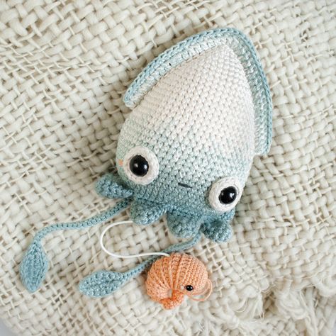 Important question 🤔: If you hug a squid does that make it a Cuddle-Fish? 🤭 - Baby Squid Seamus 🎶 Musical Amigurumi Toy, tune: Under the Sea #crochetpattern and #crochetkit → lalylala.com (link in bio) - #lalylala #lalylaland #lalylalapattern #amigurumi #amigurumipatterns #crochetpatterns #häkeltier #häkelspielzeug #crochettoys #amigurumisquid #crochetshrimp #amigurumioctopus #crochetoctopus #funfactsoftheday #amigurumishrimp #crochetinspiration #crocheters #crochethat #crochetsociety ... Crochet Squid Pattern Free, Crochet Squid Pattern, Cuddle Fish, Squid Pattern, Crochet Squid, Baby Squid, Crochet Octopus, Crochet Kit, Amigurumi Toys