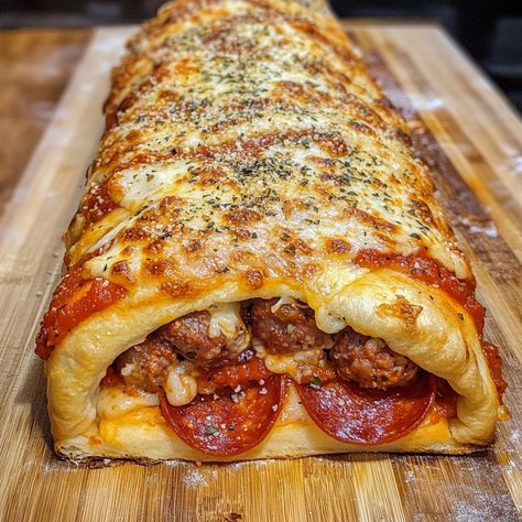 🥖 Homemade Stromboli—crispy on the outside, cheesy on the inside, and packed with your favorite fillings! 🍕🔥 #StromboliLove #HomemadeDelights Homemade Stromboli Ingredients: Pizza dough (1 lb) Mozzarella cheese (2 cups, shredded) Pepperoni slices (1 cup) Italian sausage (1/2 lb, cooked) Marinara sauce (1/2 cup) Parmesan cheese (1/4 cup, grated) Egg wash (1 egg, beaten) Italian seasoning (1 tsp) Instructions: Preheat oven to 400°F (200°C). Roll out pizza dough into a large rectangle. Sprea... Stromboli Filling Ideas, Pizza Stuffed Crescent Rolls, Stromboli With Pizza Dough, Rolled Pizza, Dessert Pizza Recipe, Pepperoni Rolls Recipe, Italian Sausage Pizza, Homemade Stromboli, Twisted Recipes