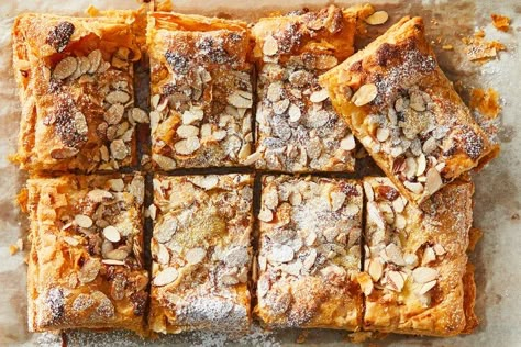 Giant Almond Croissant Recipe (with Video) - NYT Cooking Giant Almond Croissant Nyt, Giant Almond Croissant, Puff Pastry Almond Croissant, Frangipane Puff Pastry, Almond Croissant Bars, Frangipane Croissant, Easy Bake Breakfast, Almond Croissant Filling, Giant Croissant