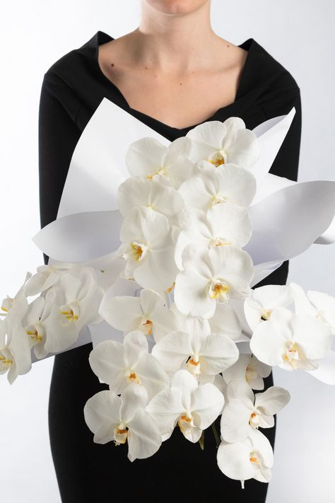 Our single variety en masse bouquet. Single Stem Orchid Bouquet, Black And White Cascade Bouquet, Orchid Cascading Bouquet, White Orchid Bouquet Cascading, Black And White Orchid, Phalaenopsis Orchid, Orchids, Flowers, White