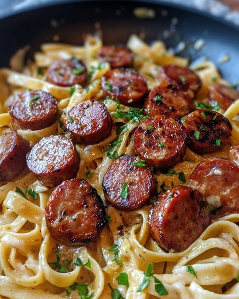 Emily Recipes - Garlic Butter Sausage Bites with Creamy... Garlic Butter Sausage Bites, Sausage With Pasta, Andouille Pasta Recipes, Garlic Butter Sausage Pasta, Smoked Sausage And Pasta Recipes, Kielbasa Recipes Pasta, Tortellini And Sausage Recipes, Smoked Sausage Pasta Recipes, Pasta And Sausage Recipes