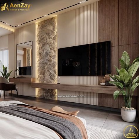 Bedroom Interior Design by aenzay With Beautiful Stone Work In the Feature wall with luxe hanging lights adorning the space with style. Inspiring and captivating interior elements are incorporated in media wall and planters are added to bring freshness to the space.

#aenzayinteriors #bedroom #bedroomdecor #bedroomdesign #bedroomideas #bedroomfurniture #bedroominterior #bedroomdetails #bedding #luxury #luxurylifestyle Luxury Bedroom Tv Unit Design, Bedroom Classic Luxury, Bedroom Tv Unit Design, Modern Tv Room, Backdrop Tv, Bedroom Tv Wall, Bedding Luxury, Interior Elements, Bedroom Tv