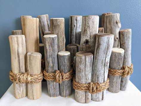 "Decorate your home with this unique nautical or lake themed driftwood piling decor with options of added bobbers! I took genuine driftwood branches from the shores of the Tennessee river and cut them into three sizes of piling pieces. Then I sanded the ends and edges to make them smooth and splinter free, but not too much so as to deplete the natural look! Then I glued them together in a bunch and wrapped natural color jute rope around, securing it firmly. I have not sealed it with any clear co Nautical Table Decor, Nautical Outdoor Decor, Nautical Bar, Nautical Bridal Shower, Beach Wall Hanging, Lake Theme, Nautical Table, Fishers Of Men, Dream Beach Wedding