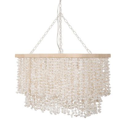 Transform your home into a serene coastal retreat with our white clam shell hanging lamp. This exquisite lighting fixture is designed to bring the calming essence of the ocean into your living space. Measuring 32" x 16" x 18.5", it is perfectly sized to become a focal point in any room, be it your living room, dining area, or bedroom. At the heart of its design is a beautiful curtain of white clam shells, meticulously strung together to create a stunning visual effect. When illuminated, the shel Shell Curtain, Shell Hanging, Dining Table Lighting, Table Lighting, Rectangle Chandelier, Nature Color Palette, Coastal Retreat, Beautiful Curtains, Coastal Chic