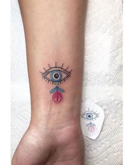 Evil Eye Tattoo. Greek Evil Eye Tattoo, Wrist Tattoos Quotes, Evil Eye Tattoo, Cool Wrist Tattoos, Couples Tattoo Designs, Small Tattoos With Meaning, Wrist Tattoos For Guys, Small Wrist Tattoos, Cartoon Eyes