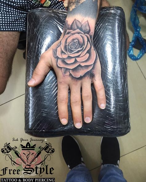 rose tattoo on hand realistic rose tattoo Hand Tats Men Rose, Rose Tattoo Design On Hand, Hand Rose Tattoo Design, Rose Tattoo In Hand, Hand Rose Tattoo Men, Rose Tattoo Men Hand, Rose Hand Tattoo Design, Black Rose Hand Tattoo, Tattoo On Hand For Men