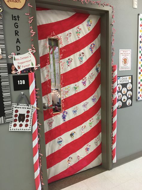 Had the kids color candy canes and we put a candy cane garland around the door, and pool noodles on the sides. We painted white butcher paper to make the candy cane shape Candy Cane Christmas Door Decorations, Candy Cane Lane Classroom Door, Candy Cane Door Decorations Classroom, Candy Cane Office Decorations, Candy Cane Office Theme, Candy Cane Lane Hallway Decorations, Candy Cane Hallway Decorations, Candy Cane Lane School Hallway, Candy Cane Classroom Decorations