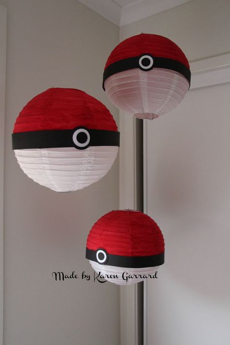 We made these Pokemon balls to hang above the food table. I purchased the white lanterns from Coles or Woolworths painted the top half red and just added black and white cardstock to middle. After the party they can hang in the childs bedroom with clear thumb tacks and thread. Pokemon Bedroom Ideas, Pokemon Birthday Party Ideas, Pokemon Balls, Pokemon Bedroom, Pokemon Decor, Pokémon Birthday, Pokemon Room, Pokémon Party, Pokemon Diy