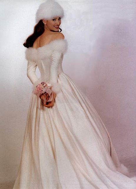 I want this WITHOUT the hat obviously and WITHOUT the fur trim at the top.  I want just plain satin long-sleeve NO lace.  I like how this reminds me of Sleeping Beauty's dress. Fur Wedding Dress, Christmas Wedding Dresses, Winter Wedding Gowns, Wedding Fur, Long Sleeve Wedding Gowns, Winter Bride, White Wedding Dress, Winter Wonderland Wedding, Wonderland Wedding