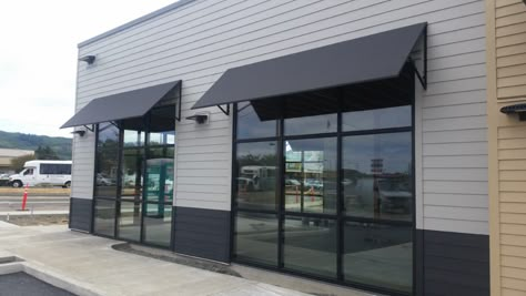 Commercial Awnings - Pike Awning Inc. | Quality Awnings and Canopies Modern Awnings Exterior, Black Commercial Building Exterior, Modern Commercial Building Exterior, White And Black Commercial Building, Commercial Awning Ideas, Modern Warehouse Design Exterior, Business Awnings Store Fronts, Modern Warehouse Design, Commercial Building Awnings