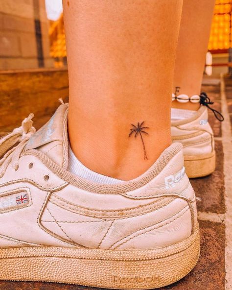 Fine line palm tree tattoo located on the ankle. Florida Idea Tattoos, Palm Tree Tattoo Minimal, Ankle Tattoo Locations, Tattoo Ideas Female Palm Tree, Palm Tree On Ankle, Palm Tree Tattoo On Ankle, Dolphin Tattoo On Ankle, Simple Island Tattoo, Ankle Tattoo Palm Tree