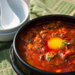 Korean Soft Tofu Stew (Soon Du Bu Jigae) - Allrecipes.com Korean Tofu Stew, Soon Tofu, Soft Tofu Stew, Korean Tofu, Tofu Stew, Soft Tofu, Tofu Soup, Cooking Tofu, Korean Cooking