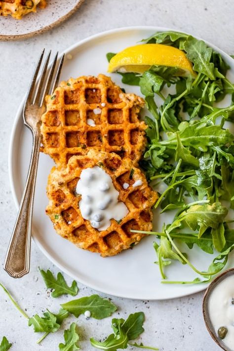 These easy waffled Salmon Cakes, made with pantry and refrigerator staples are cooked in a waffle maker – only 10 minutes from start to finish! #healthyrecipe #salmon #salmonrecipes #healthysalmonrecipes #dinnerrecipes #lunchrecipes #healthyrecipes #weightwatcherrecipes #lowcalorierecipes #glutenfreerecipes #waffleironrecipes #wafflemakerrecipes Salmon Waffles, Refrigerator Staples, Healthy Salmon Cakes, Easy Salmon Cakes, Apartment Meals, Salmon Cake, Salmon Cakes Recipe, Seafood Lunch, Waffle Iron Recipes