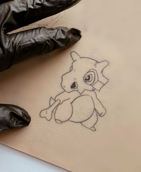 Fine Line Pokemon Tattoo, Simple Pokemon Tattoo, Cubone Tattoo, Tattoo Chart, Fandom Tattoos, Tattoo Fine Line, Tattoo 2023, Tattoo Board, Pokemon Tattoo