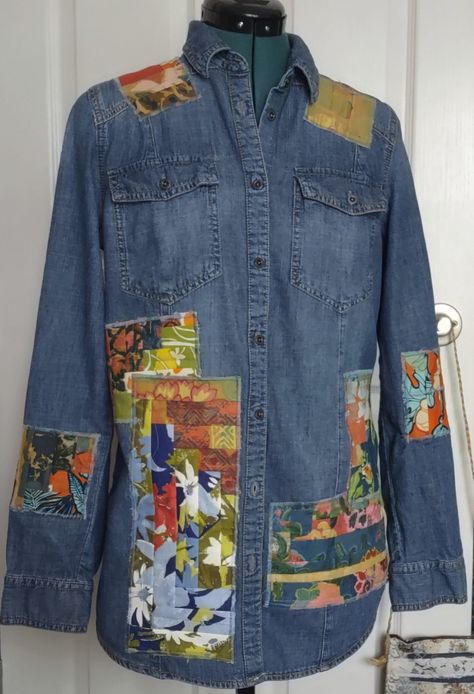 "Refashioned denim shirt  - machine applique patchwork pieces from a pieced quilt top that was never finished  - button-down, long sleeves  - looks great over straight leg jeans or leggings - tag says size M, very slim  - see measurements below -handwash, dry flat or delicate  One of a kind - see picture with measurements near 18\" under the arms; 13.5\" across shoulders" Recycle Clothes Refashioning, Upcycle Shirts, Ombre Flannel Shirt, Denim 2023, Refashion Jeans, Jean Jacket Diy, Denim Upcycle, Reuse Clothes, Shirt Patchwork