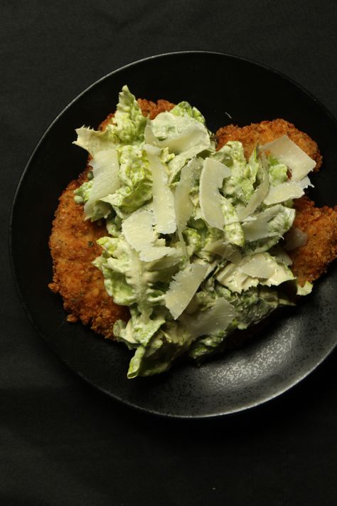 My favorite dinner recipe. A cold caesar salad on top of a crispy, hot fried chicken cutlet. A perfect combination of fresh and indulgent. Check out the recipe on my blog now! The Best Caesar Salad, Best Caesar Salad, Chicken Caesar Salad Recipe, Fried Chicken Cutlets, Homemade Caesar, Caesar Chicken, Schnitzel Recipes, Shaved Parmesan, Chicken Cutlet