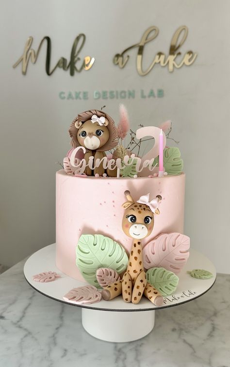 A cake to celebrate two years birthday with Leo and giraffe made of sugar paste.  #CakeArt #CakeDesign #CakeDecor #CakeForChild #BirthdayCake #AnimalsThemeCake Wild Cake Birthday, Pink Safari Birthday Party Cake, Pink Jungle Cake, Two Wild Girl Cake, Wild One Girls 1st Birthday Cake, One Year Cake Girl, Cake For 3 Year Girl, Animals Cakes Birthday, Safari Birthday Cake Girl