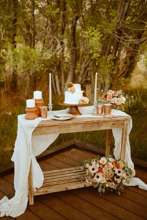 Bohemian Desert Elopement Decor Ideas for 2024 | Wedding Table Centerpieces | Elopement Planner. Let our expert elopement planner meticulously map out your unforgettable day infused with bohemian charm and rustic touches! Find rustic wedding decor table, retro desert elopement, boho wedding decor ceremony and desert elopement photoshoot. Book us to plan you an unforgettable desert elopement at emberandstoneevents.com. Photographed by Kassie Gunn. Simple Sweetheart Table Candles, Cake Table For Wedding Ideas, Bride And Groom Wedding Table Ideas, Elopement Set Up, Ceremony Table Wedding, Boho Wedding Cake Table Decor, Cake Table Wedding Simple, Elopement Cake Table, Elopement Table Setting