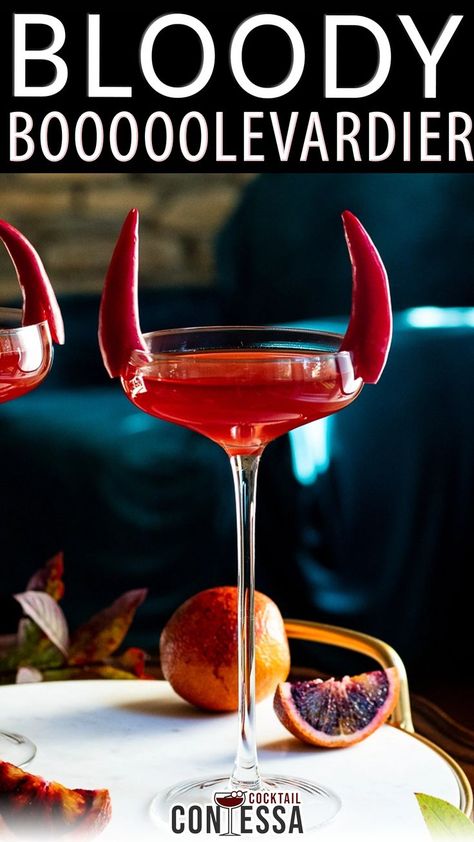 Halloween is the time for bloody and bitter cocktails and this easy Boulevardier riff is perfect as a single cocktail or batched as a Halloween drink. In this cocktail we take a classic Boulevardier, top it with blood orange soda and add a fun pepper garnish to give the whole thing some horns. | @cocktailcontessa #halloweencocktails #diyhalloweencocktailparty #fallcocktailparty #halloweenpartycocktails Orange Alcoholic Drinks, Halloween Whiskey, Fall Cocktail Party, Halloween Drinks Alcohol, Boulevardier, Cocktail Decoration, Halloween Drink, Drink Garnishing, Orange Cocktails