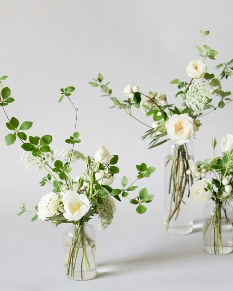 Simple Wedding Flower Table Arrangements, Bud Vases With White Flowers And Greenery, Wedding Tablescapes Greenery, Small Bud Vase Arrangements, Wildflower Bud Vases Wedding, Bud Vases White Flowers, Small Table Flower Arrangements, White Bud Vases Wedding, Compote Centerpiece Wedding