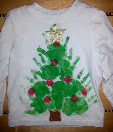 Christmas handprint shirts Handprint tree Toddler Time Tips https://www.facebook.com/toddlertimetips Hand Print Tree, Diy Christmas Shirts, Spirit Days, Handprint Christmas, Ugly Christmas Shirts, Christmas Shirts For Kids, Christmas Clothes, Footprint Art, Christmas Tree Shirt