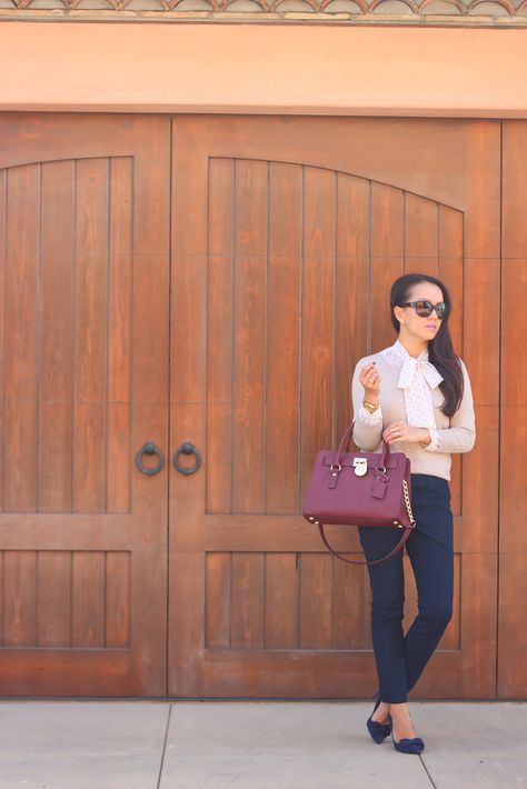 Beige sweater, navy Sloan pants, polka dot tie neck blouse, Chanel sunglasses, burgundy tote, bow pumps  //  Click the following link to see all photos and details:  http://www.stylishpetite.com/2014/10/burgundy-bag-and-michael-kors-favorites.html Burgundy Purse, Burgundy Bag, Stylish Petite, Bag Outfit, Cheap Michael Kors, Michael Kors Outlet, Michael Kors Wallet, Street Style Inspiration, Michael Kors Hamilton